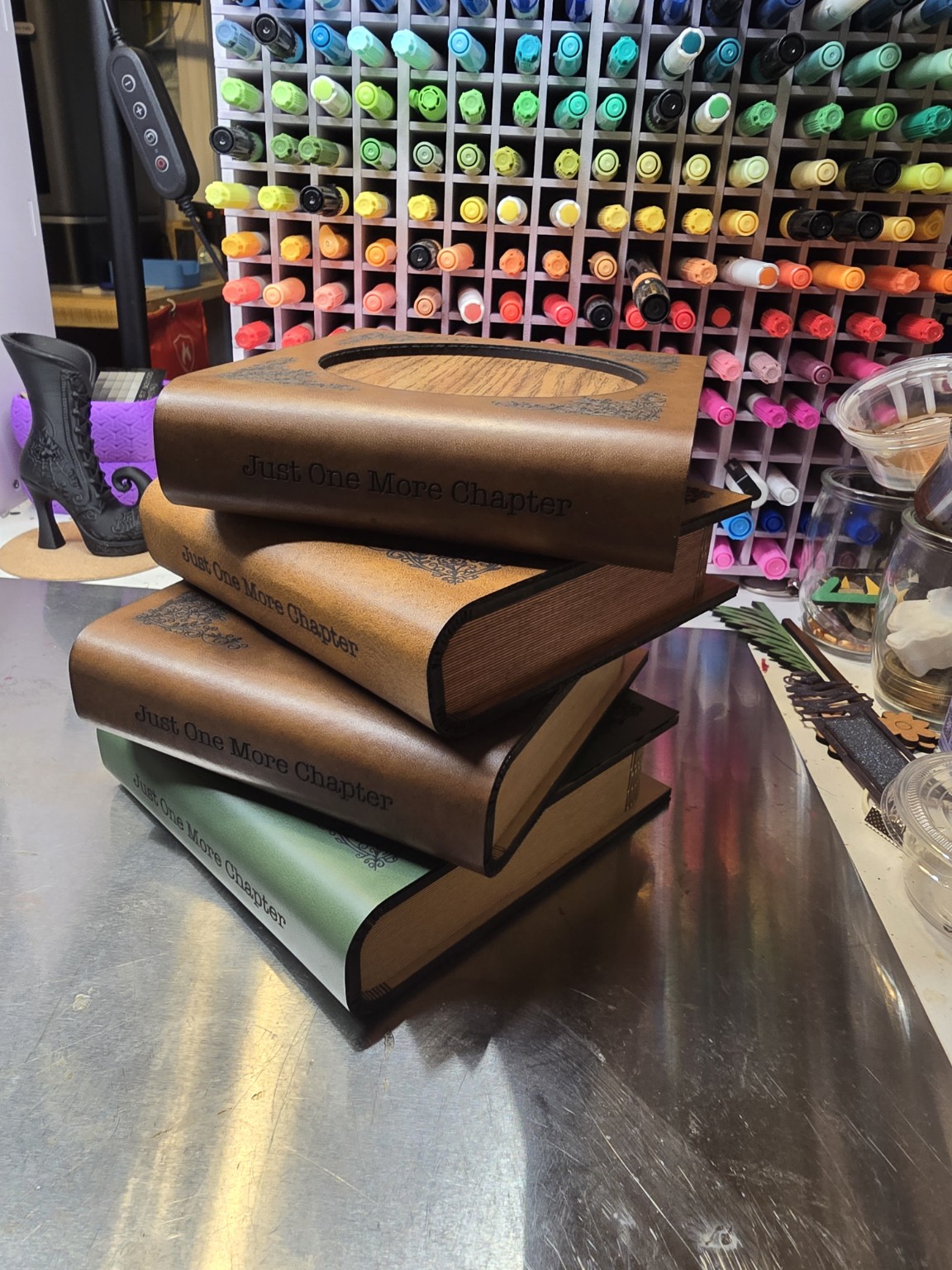 Stack of book-shaped coaster sets with storage