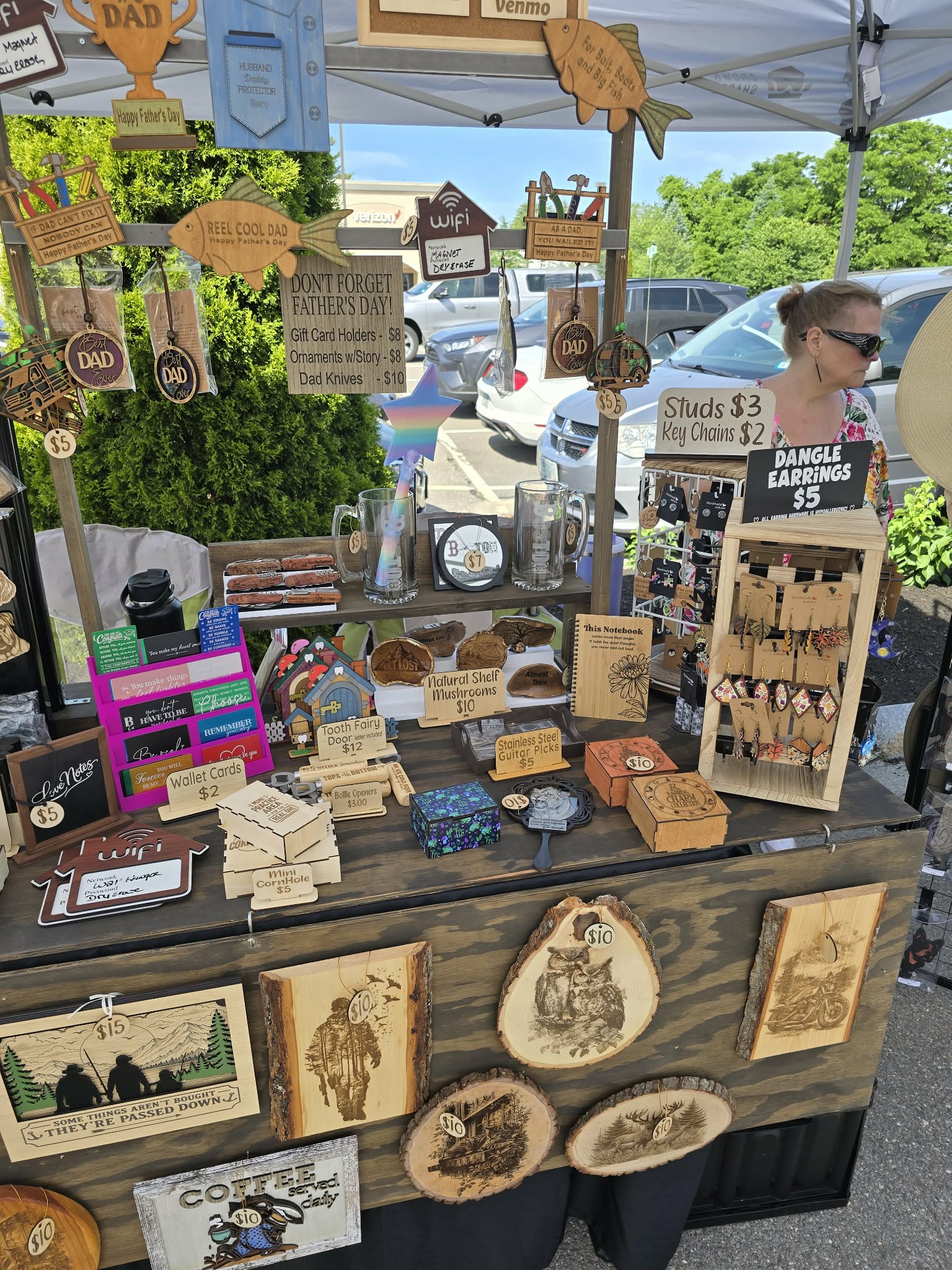 Market display shelves filled with handmade wooden pieces and gifts