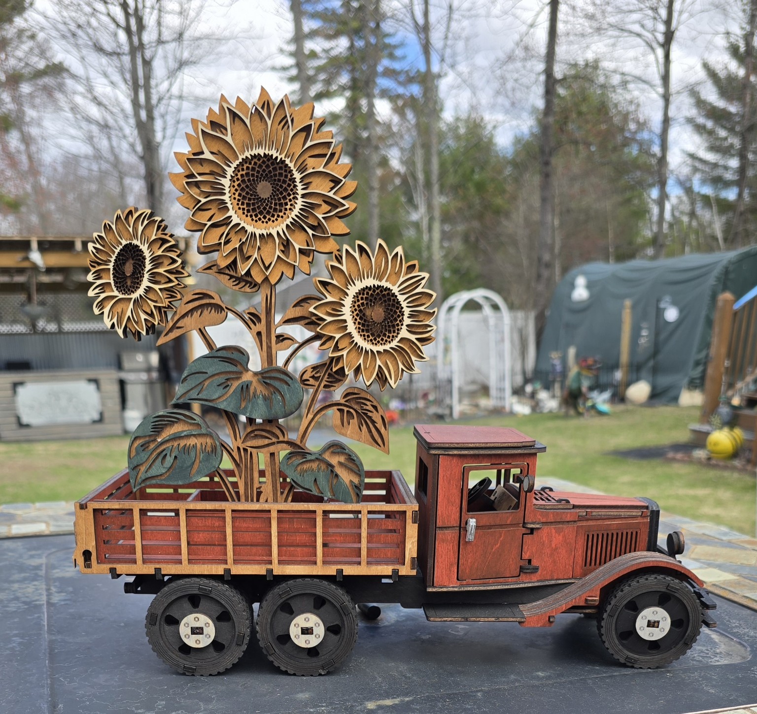 Handmade sunflower decor displayed at a market